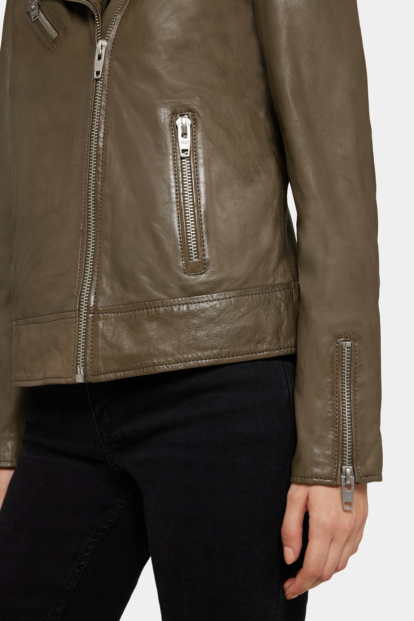 Close-up of the Yaya leather jacket in dusty olive.